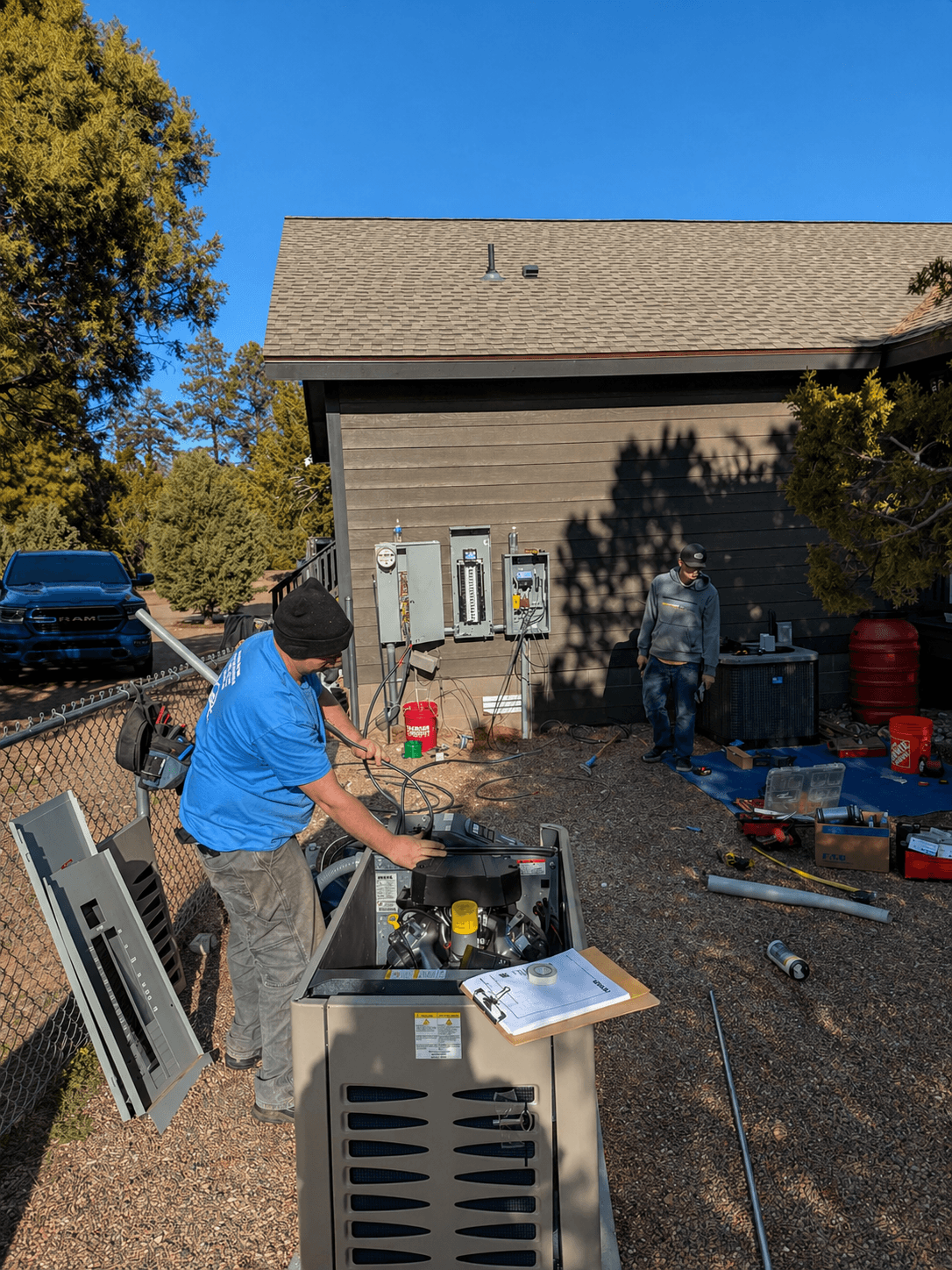 Rizen Electric crew working on a residential backup generator installation